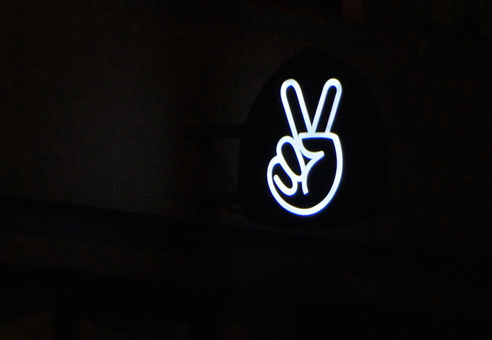 neon sign melbourne peace sign